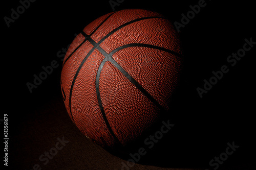 Basketball ball isolated on black background.