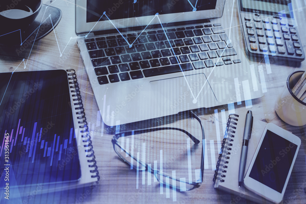 Forex market chart hologram and personal computer background. Double exposure. Concept of investment. Forex market chart hologram and personal computer background. Double exposure. Concept of investment.