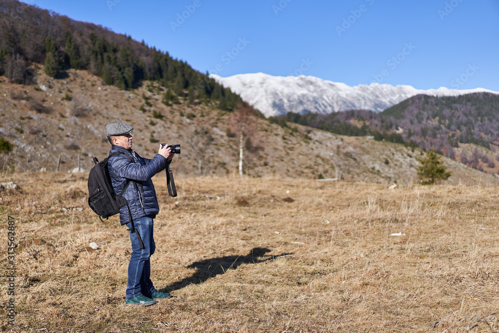 Fototapeta premium Man with backpack in the countryside