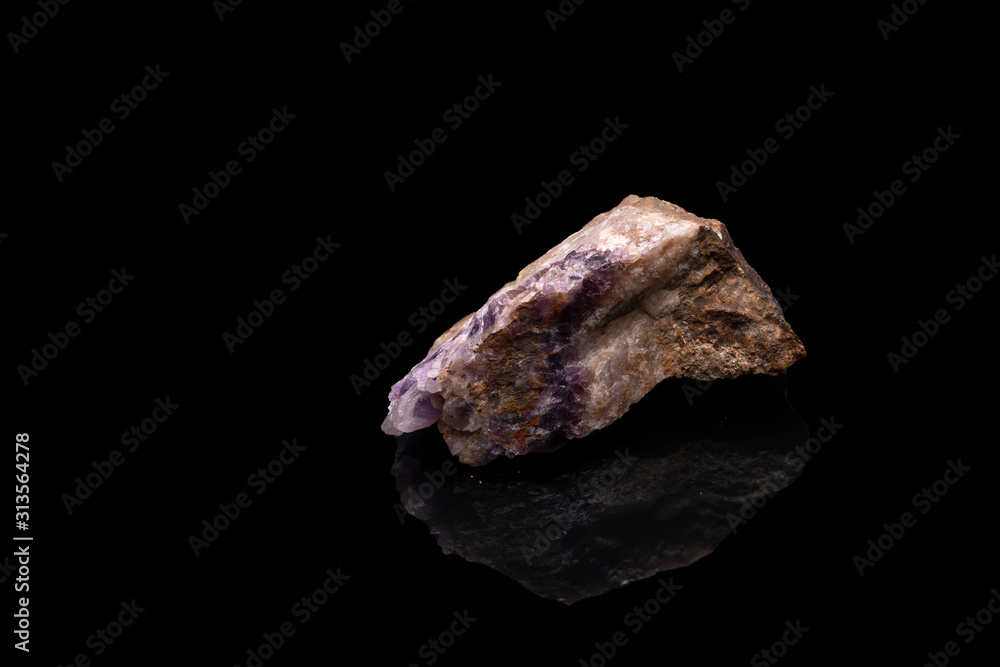 Purple rough Amethyst quartz crystals geode isolated on black Purple rough Amethyst quartz crystals geode isolated on black