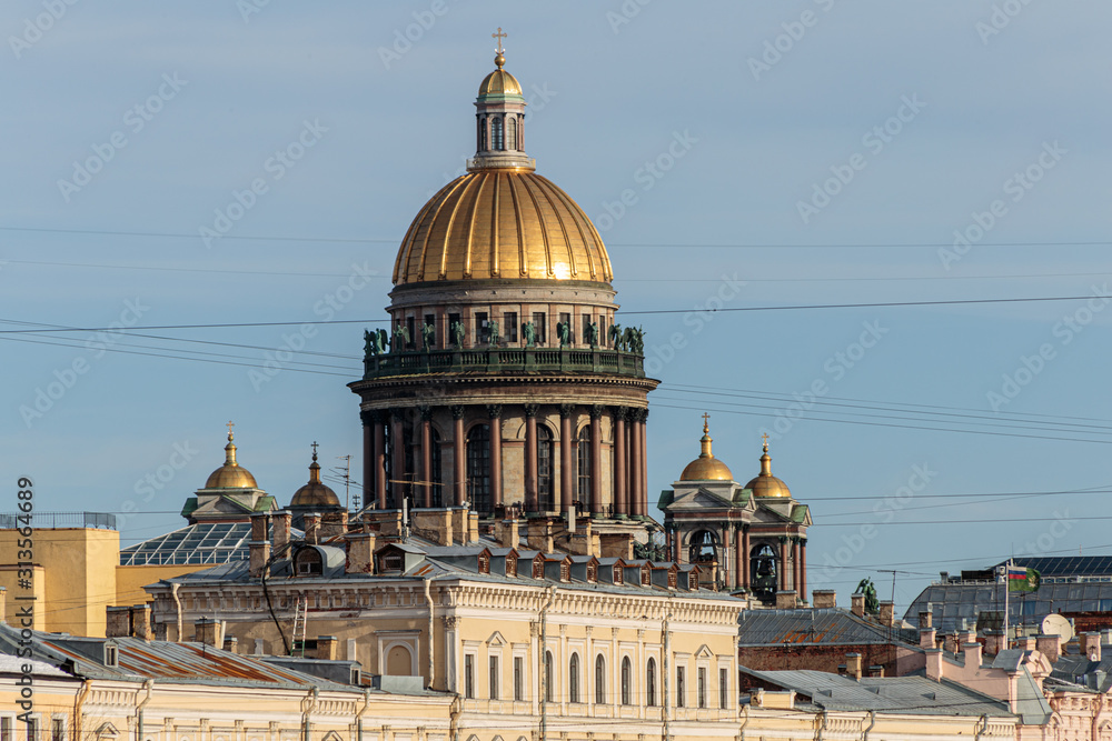 Winter view of the Saint Isaac's Cathedral from the Moika river embankment, St. Petersburg, Russia.
