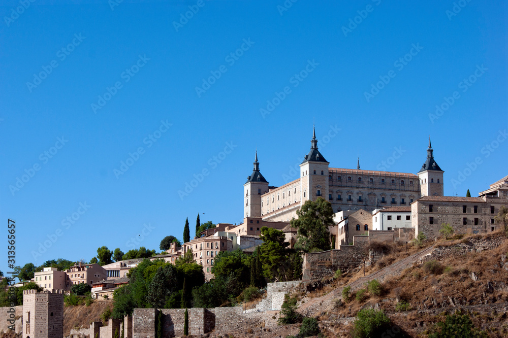 View of the historic Alcazar in the ancient Spanish city of Toledo.  This monument is dramatically sited on a high hill overlooking the river Tajo.