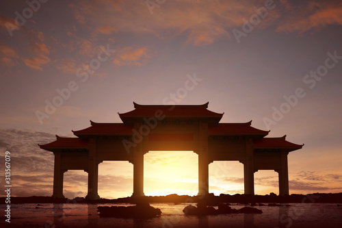 Vászonkép Chinese pavilion gate with red roof on the beach