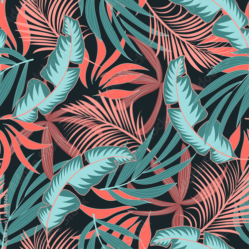 Fashionable seamless tropical pattern with bright pink and blue plants and leaves on a green background. Summer colorful hawaiian seamless pattern with tropical plants. Printing and textiles. 