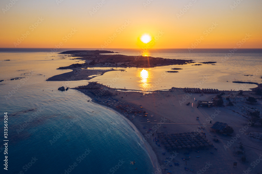Obraz premium Aerial view of beautiful tropical Elafonissi Beach with pink sand. View of a nice tropical Elafonissi beach from the air. Beautiful sky, sea, resort. Elafonissi beach, Crete, Greece.