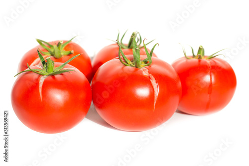 Group of red fresh tomatoes isolated on white background