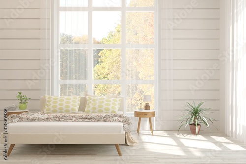 White stylish minimalist bedroom with armchair and autumn landscape in window. Scandinavian interior design. 3D illustration