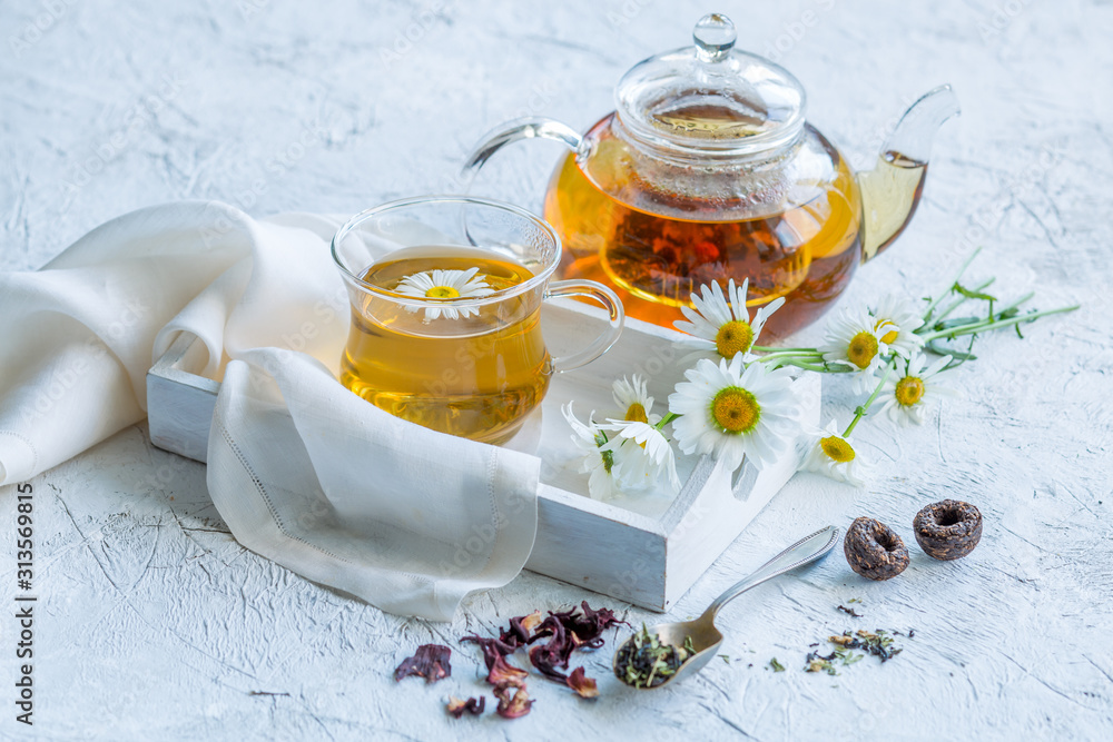 Chamomile tea in a glass teapot Chamomile tea in a glass teapot