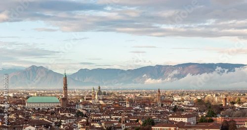 Aerial view of the city of Vicenza in Italy at sunset. The city of Palladio, from the name of the architect who designed most of his works here in the late Renaissance. Sky clearing after a rainy day.