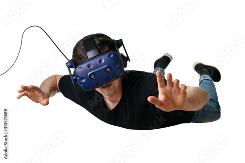 Obraz na płótnie Young man flying in zero gravity space and experiencing virtual reality in 3d go