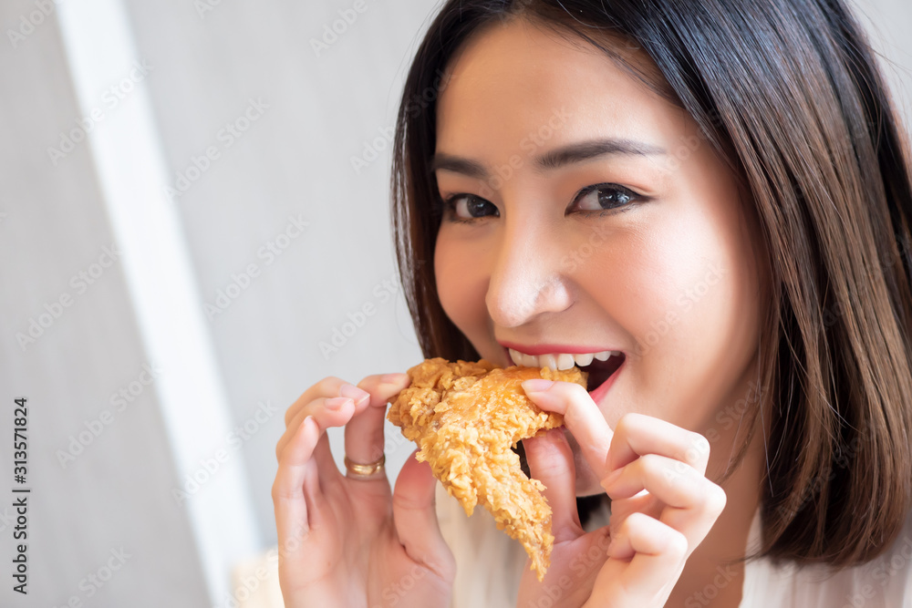 hungry woman looking, eating fried chicken, concept of delicious food, health care, eating habit, yummy fried chicken