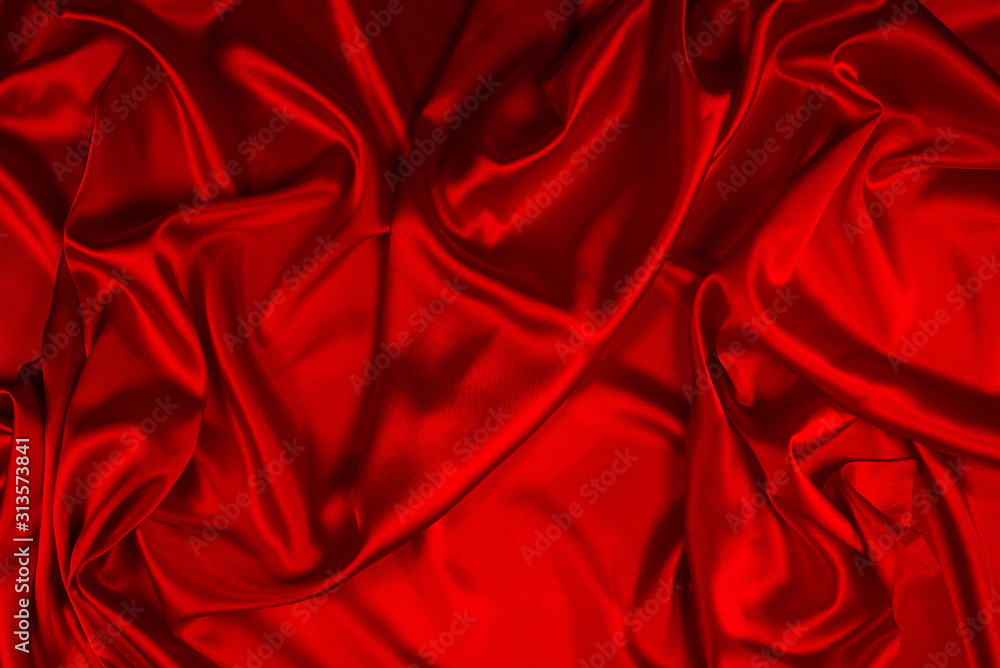 Red silk or satin luxury fabric texture can use as abstract background. Top view. Red silk or satin luxury fabric texture can use as abstract background. Top view.
