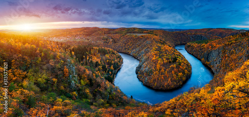 Beautiful Vyhlidka Maj, Lookout Maj, near Teletin, Czech Republic. Meander of the river Vltava surrounded by colorful autumn forest viewed from above. Tourist attraction in Czech landscape. Czechia.