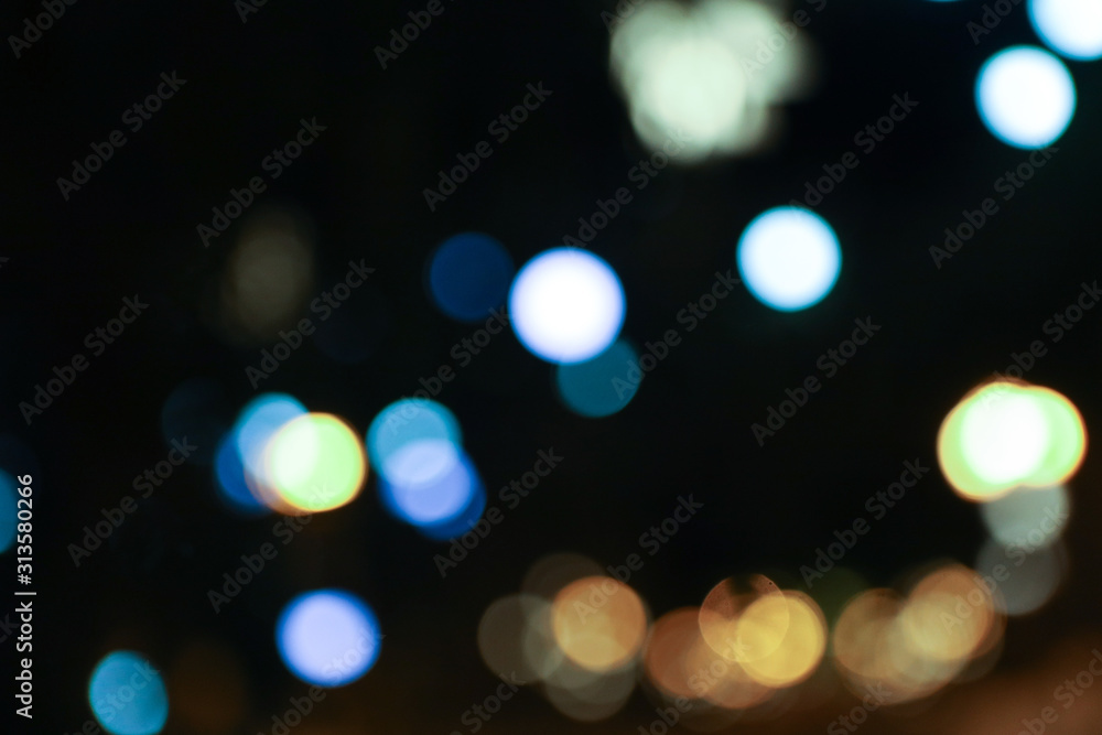 Fototapeta premium Color bokeh of warm light bulbs without focus, defocus