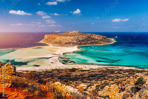 Fantastic panorama of Balos Lagoon and Gramvousa island on Crete, Greece. Cap tigani in the center. Balos beach on Crete island, Greece. Tourists relax and bath in crystal clear water of Balos beach. photo