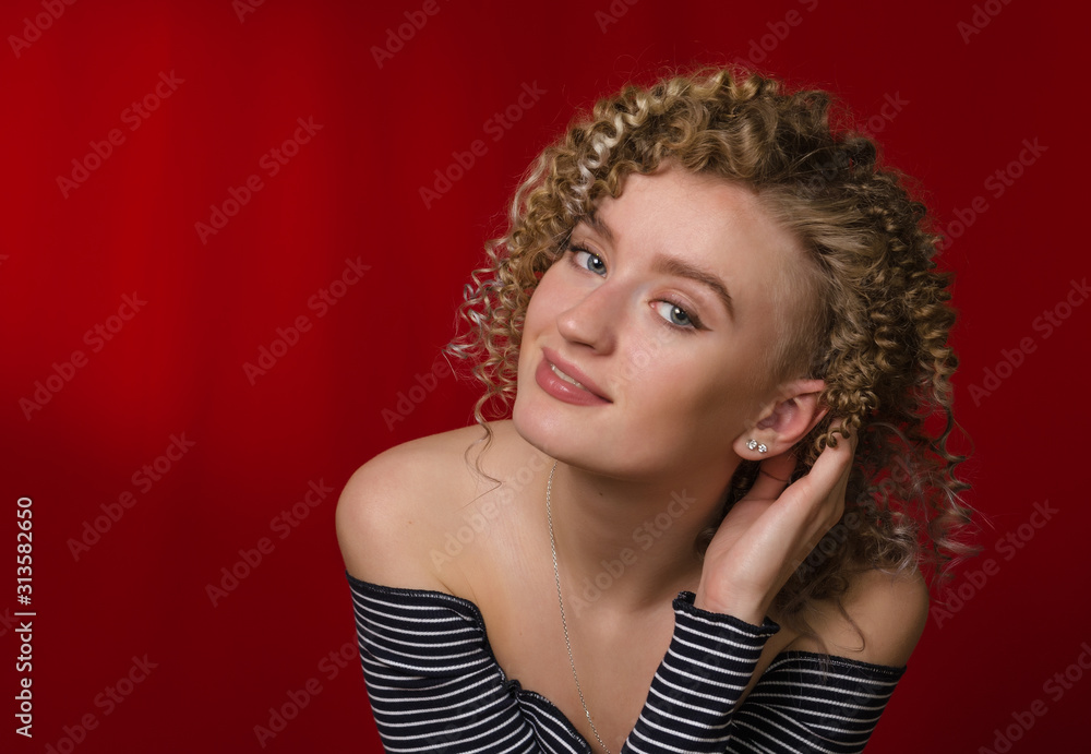 Young happy girl with blond curly hair Young happy girl with blond curly hair