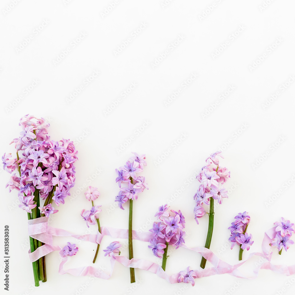 Floral bouquet of hyacinth flowers, petals and tapes on white background. Flat lay Floral bouquet of hyacinth flowers, petals and tapes on white background. Flat lay