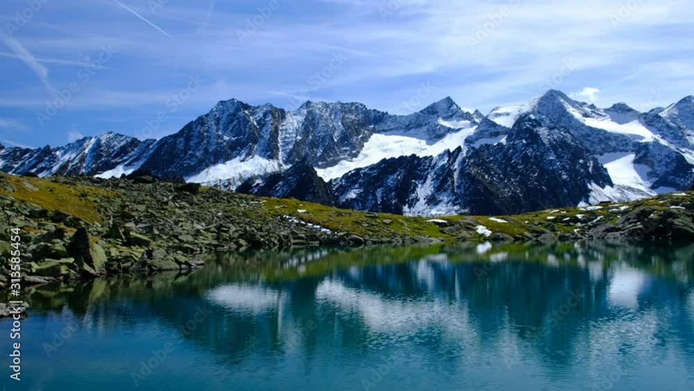 Lake with mountains in background, Rinnensee, Aperer Turm, Stubaital, Tyrol, Austria Lake with mountains in background, Rinnensee, Aperer Turm, Stubaital, Tyrol, Austria