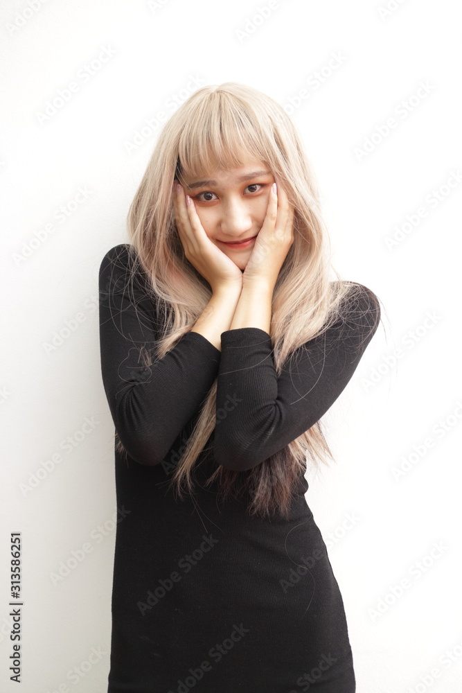Beautiful girl makes herself the makeup, isolated Beautiful Asian models over background for advertising concept Beautiful girl makes herself the makeup, isolated Beautiful Asian models over background for advertising concept