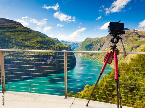 Camera on tripod taking fjord photo, Norway photo