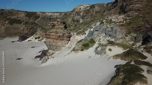 4K summer day aerial drone video: beautiful white sand Diaz Beach at Cape of Good Hope Nature Reserve, most popular tourist attraction, near Cape Town in Cape Peninsula, Western Cape, South Africa photo