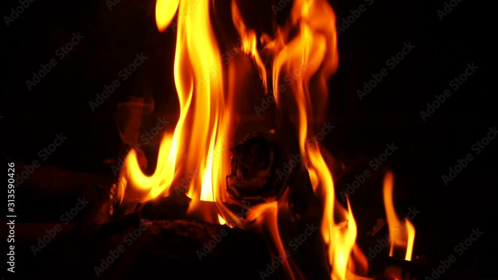Slow motion video of cosy fireplace with reddish flame burning during winter holidays Slow motion video of cosy fireplace with reddish flame burning during winter holidays