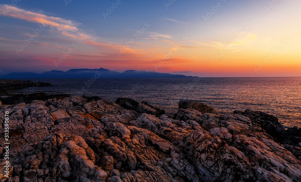 Splendid colorful seascape during sunset. Incredible nature Landscape. Amazing beach sunset with Picturesque sky. Unsurpassed sunrise over the Ionian Sea. Scenic nature sunset above sea. Greece Splendid colorful seascape during sunset. Incredible nature Landscape. Amazing beach sunset with Picturesque sky. Unsurpassed sunrise over the Ionian Sea. Scenic nature sunset above sea. Greece