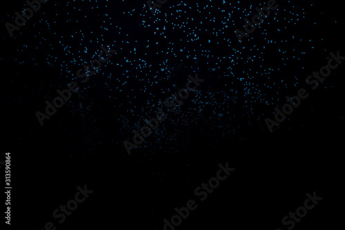 Blue shiny background of sparkles. Festive concept.