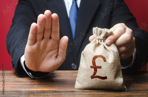 Φωτογραφία Businessman refuses to give pound sterling GBP money bag