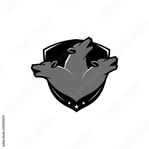 Three wolf heads securing the logo