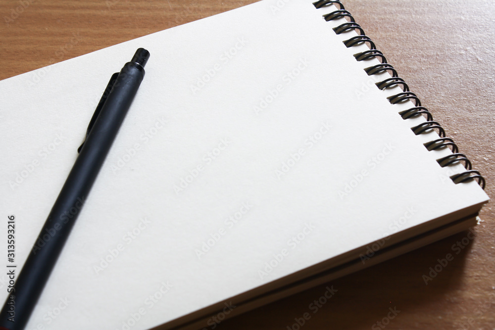 Notebook and pen stationery on the table. Notebook and pen stationery on the table.