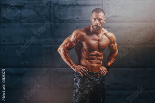 Portrait of Handsome Muscular Men. Bodybuilder posing and Flexing Muscles © mrbigphoto