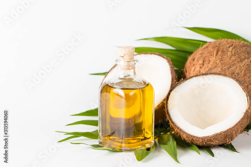 Ripe half cut coconut on a wooden background. Ripe half cut coconut on a wooden background. Coconut cream and oil.