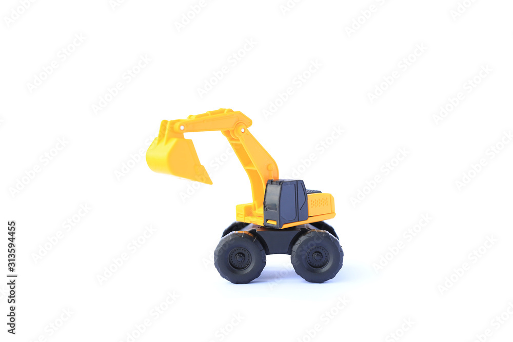 The yellow toy car Excavator isolated on white background. Children's backhoe toy model. The yellow toy car Excavator isolated on white background. Children's backhoe toy model.