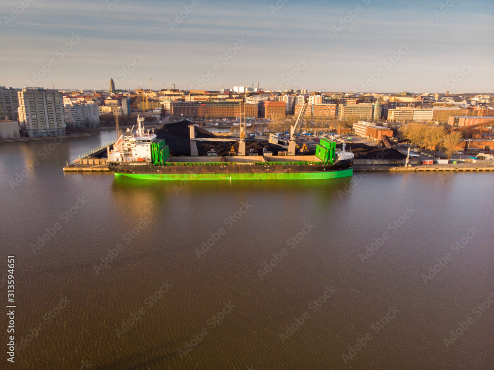 Fototapeta premium the vessel unloads in port. Aerial drone view