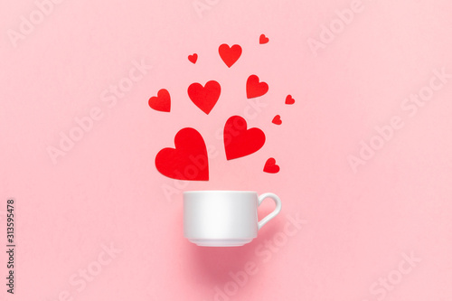 Valentines day concept made of coffee cup and red paper hearts