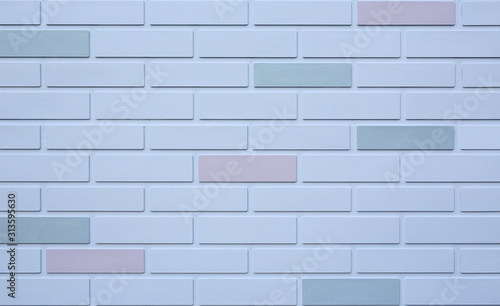 Background of white brick wall with some different color.