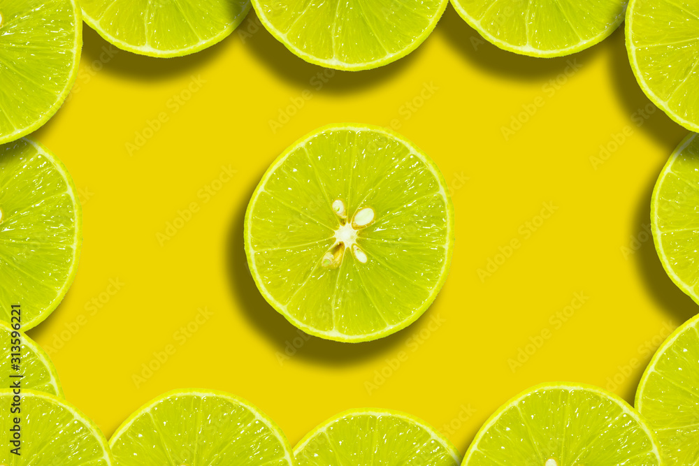 Half lemon pattern flat lay on a vivid yellow background