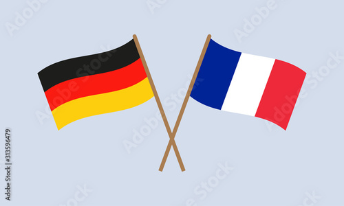 Germany and France crossed flags on stick. German and French national symbols. Vector illustration.