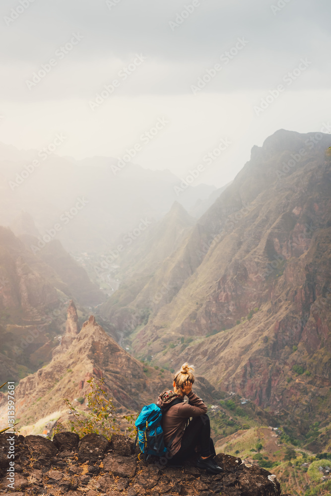 Santo Antao Island Cape Verde. Female tourist enjoying breathtaking view of impressive Ribeira da Torre valley surrounded by towering mountain tops