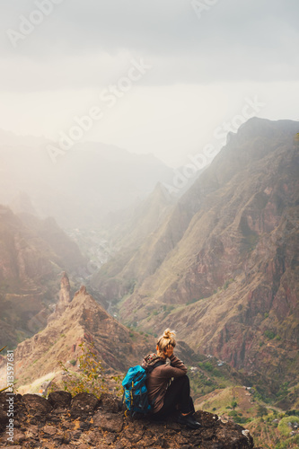 Santo Antao Island Cape Verde. Female tourist enjoying breathtaking view of impressive Ribeira da Torre valley surrounded by towering mountain tops © Igor Tichonow