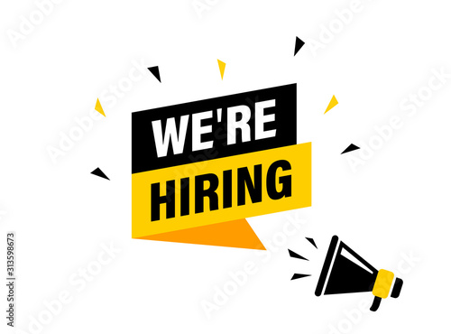 Male hand holding megaphone with we're hiring speech bubble. Loudspeaker. Banner for business, marketing and advertising. Vector illustration.