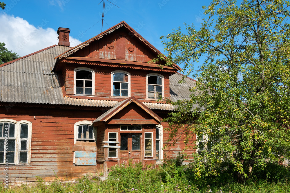 Old abandoned house with an attic in the village