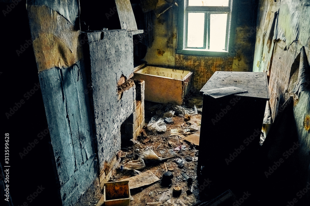A terrible mysterious apocalyptic view: an abandoned house in the abandoned Belarusian Kovali (Belarusian: blacksmiths) village - no one lives here anymore - interior: scattered things A terrible mysterious apocalyptic view: an abandoned house in the abandoned Belarusian Kovali (Belarusian: blacksmiths) village - no one lives here anymore - interior: scattered things