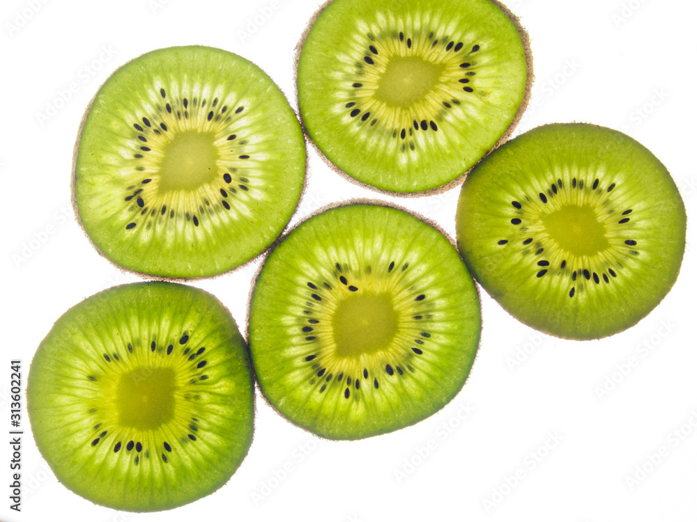 round kiwi slices on a white background. Isolated on white round kiwi slices on a white background. Isolated on white