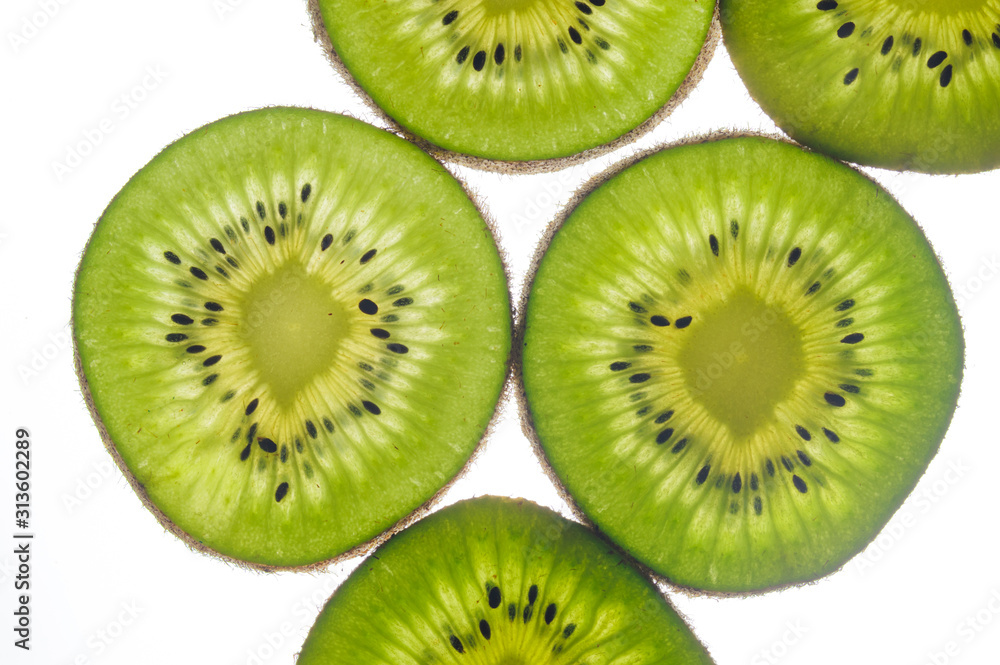 round kiwi slices on a white background. Isolated on white round kiwi slices on a white background. Isolated on white