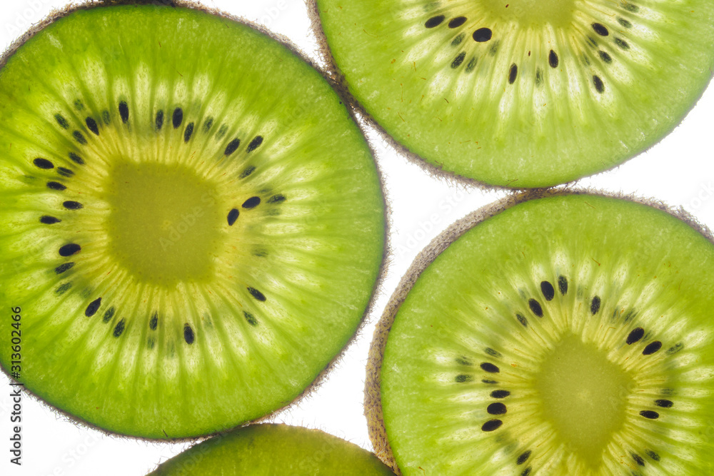 round kiwi slices on a white background. Isolated on white. close up round kiwi slices on a white background. Isolated on white. close up