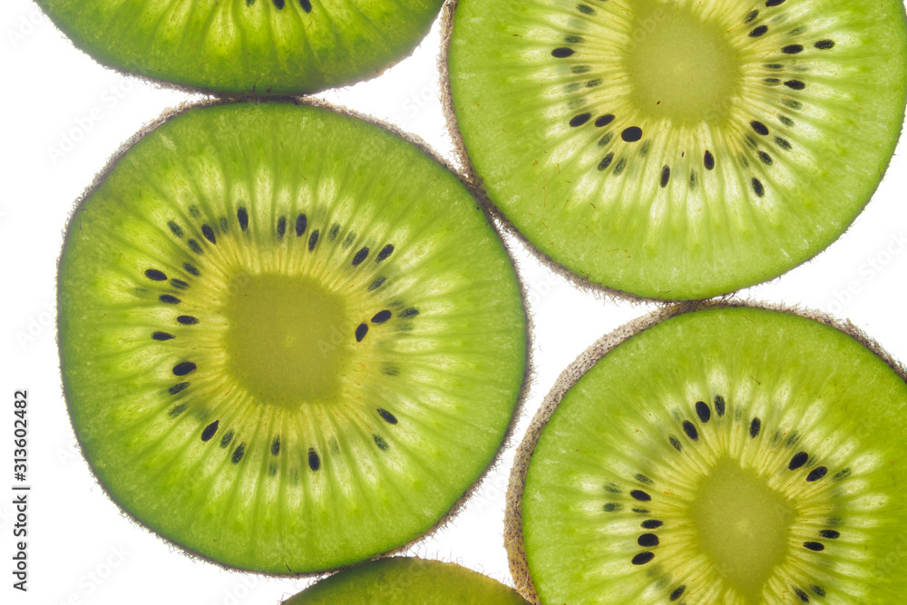 round kiwi slices on a white background. Isolated on white. close up round kiwi slices on a white background. Isolated on white. close up