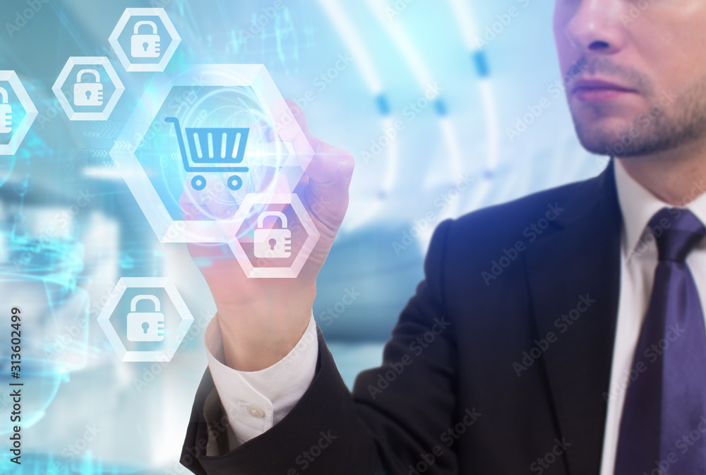 Business, Technology, Internet and network concept. Young businessman working on a virtual screen of the future and sees the inscription: Business, Technology, Internet and network concept. Young businessman working on a virtual screen of the future and sees the inscription: