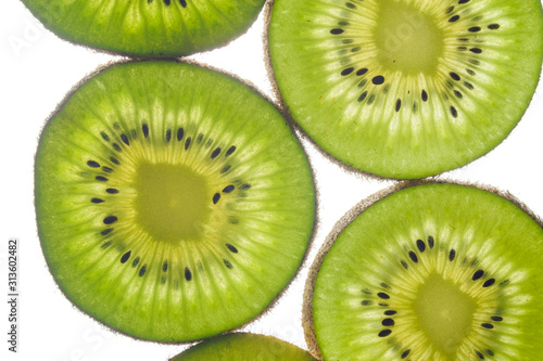 round kiwi slices on a white background. Isolated on white. close up